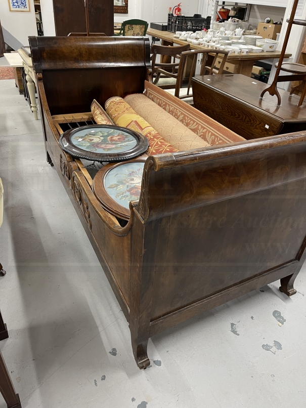 19th cent. French Empire mahogany bateaux lit bed with garland decoration and sprung base.