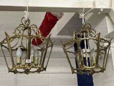 20th cent. Lighting: Pair of unglazed brass octagonal lanterns each with four lights and glass