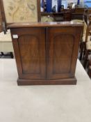 19th cent. Mahogany collectors cabinet, two arched doors opening to reveal two short over three long