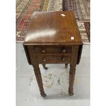 19th cent. Mahogany work table with two flaps and two drawers on turned legs and castors. 28¼ins.