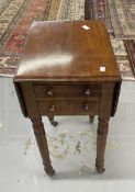 19th cent. Mahogany work table with two flaps and two drawers on turned legs and castors. 28¼ins.