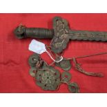Weapons: Chinese coin sword, iron roil with Chinese coins of the 19th cent. tied to it with red