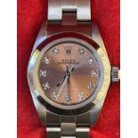 Watches: Ladies Rolex Oyster Perpetual 67180. Stainless steel with diamond set dial 1996 S/N T***