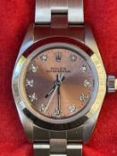Watches: Ladies Rolex Oyster Perpetual 67180. Stainless steel with diamond set dial 1996 S/N T***