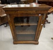 19th cent. Walnut glazed door cabinet with boxwood inlay and brass mounts to the front on a shaped