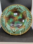 Ceramics: 19th cent. Majolica bread plate decorated with a border of leaves. 13ins.