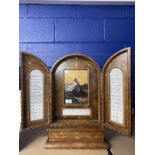 Grand Tour leather cased triptych travelling stand, the central panel with a painted scene of