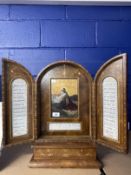 Grand Tour leather cased triptych travelling stand, the central panel with a painted scene of