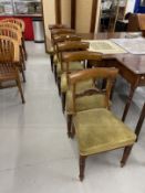 19th cent. Mahogany chairs with bar backs, carved central splat, upholstered seats on reeded legs.