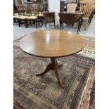 19th cent. Mahogany tilt top table, circular top, turned column, splayed legs. 28ins. x 34ins.