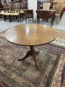 19th cent. Mahogany tilt top table, circular top, turned column, splayed legs. 28ins. x 34ins.