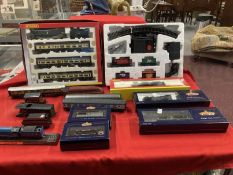 Toys: Hornby OO trains one boxed set, one cased set with tracks and various carriages, etc.