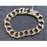 Hallmarked Jewellery: 9ct gold hammered curb link bracelet having a box snap with safety catch.