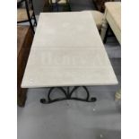Gardenalia: Wrought iron table base with composite top. 50ins. x 28ins.