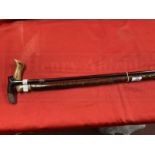 19th cent. Ebony and silver banded walking cane plus rustic example. (2)