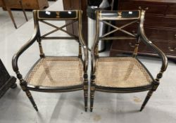 20th cent. Empire style armchairs ebonised wicker work seats with gilded decoration and crests to