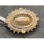 Jewellery: Edwardian yellow metal oval mourning brooch, tests as 9ct gold. Weight 5.6g.