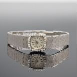 CANDINO Damenarmbanduhr mit Diamantbesatz in WG 750/000,