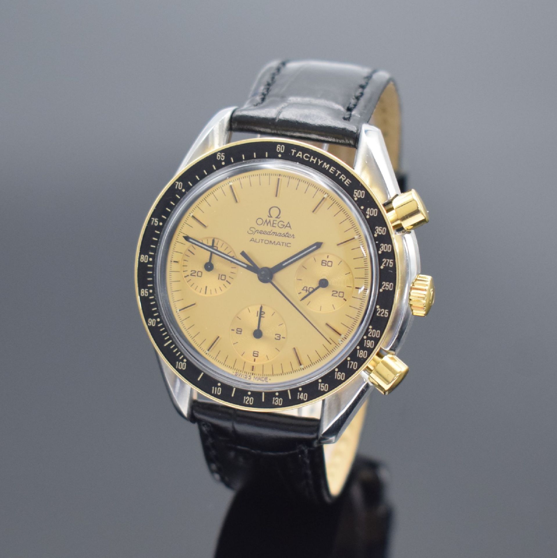 OMEGA Speedmaster Herrenchronograph in Stahl/Gold Referenz