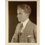 CHARLES SPENCER CHAPLIN, KNOWN AS CHARLIE CHAPLIN (1889-1977) Portrait photograph with personal ded