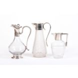 THREE MODERN STYLE CRYSTAL DECANTERS WITH METAL LIDS