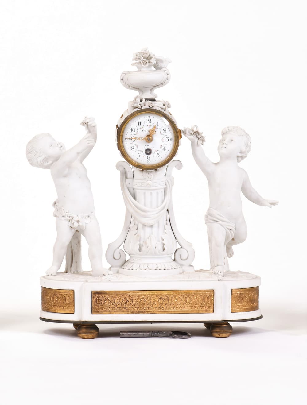 FIREPLACE CLOCK DECORATED WITH PUTTI AND GARLAND OF FLOWERS, 18th century