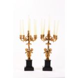 A PAIR OF GILT-BRONZE PUTTI CANDLE HOLDERS, 19th century