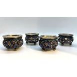 SET OF FOUR SILVER FILIGREE AND POLYCHROME ENAMEL SALT CELLARS