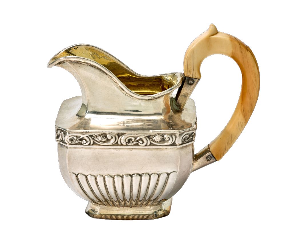 PARCEL-GILT SILVER MILK JUG WITH A BONE HANDLE