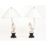 PAIR OF SILVER-PLATED METAL LAMPS WITH DANCING PUTTI