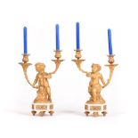 A PAIR OF LOUIS XVI STYLE GILT-BRONZE AND MARBLE PUTTI CANDLE HOLDERS