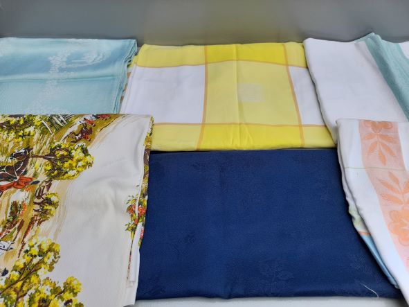 A Box Of Tablecloths & Tray cloths Etc