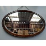 An Oak Oval Mantel Mirror
