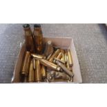 A Box Including Brass Shell Cases Etc