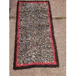 A Black Stobby Rug L130cm x W70cm