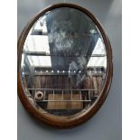 An Oak Inlaid Oval Mirror