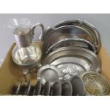 A Box Including Plated Trays, A Collection Of Pewter Plates On Stand, Spirit Jug On Stand Etc