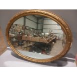 A Gilt Oval Mirror