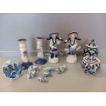 A Box Including Blue & White Candlesticks, Figurines, Lidded Jars Etc