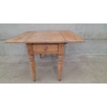A Pine Drop Leaf Kitchen Table H75cm x L107cm x W113cm