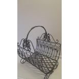 A Wrought Iron Log Basket