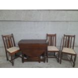 An Oak Drop Leaf Table & 3 Chairs H72cm x L135cm x W97cm