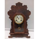 An Oak & Brass Faced Mantel Clock