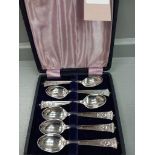 A Set Of Plated Teaspoons In Case