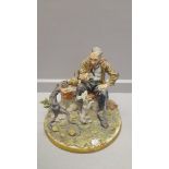 Capodimonte Figure - Man Feeding Dog With A Bone By Tyche Tosca