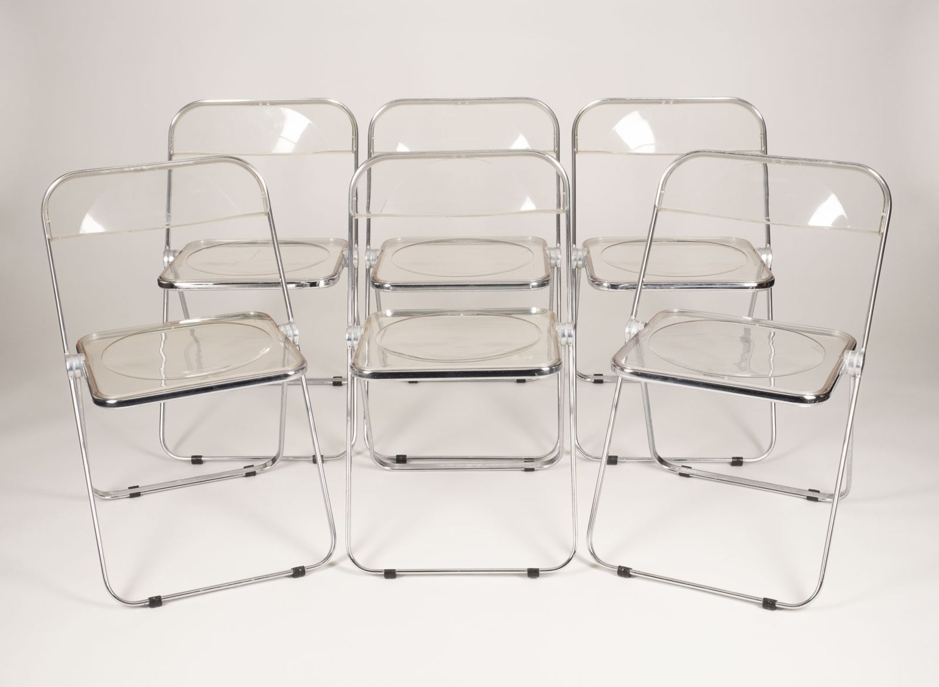 Sechs Stühle / Klappstühle Modell 'Plia'