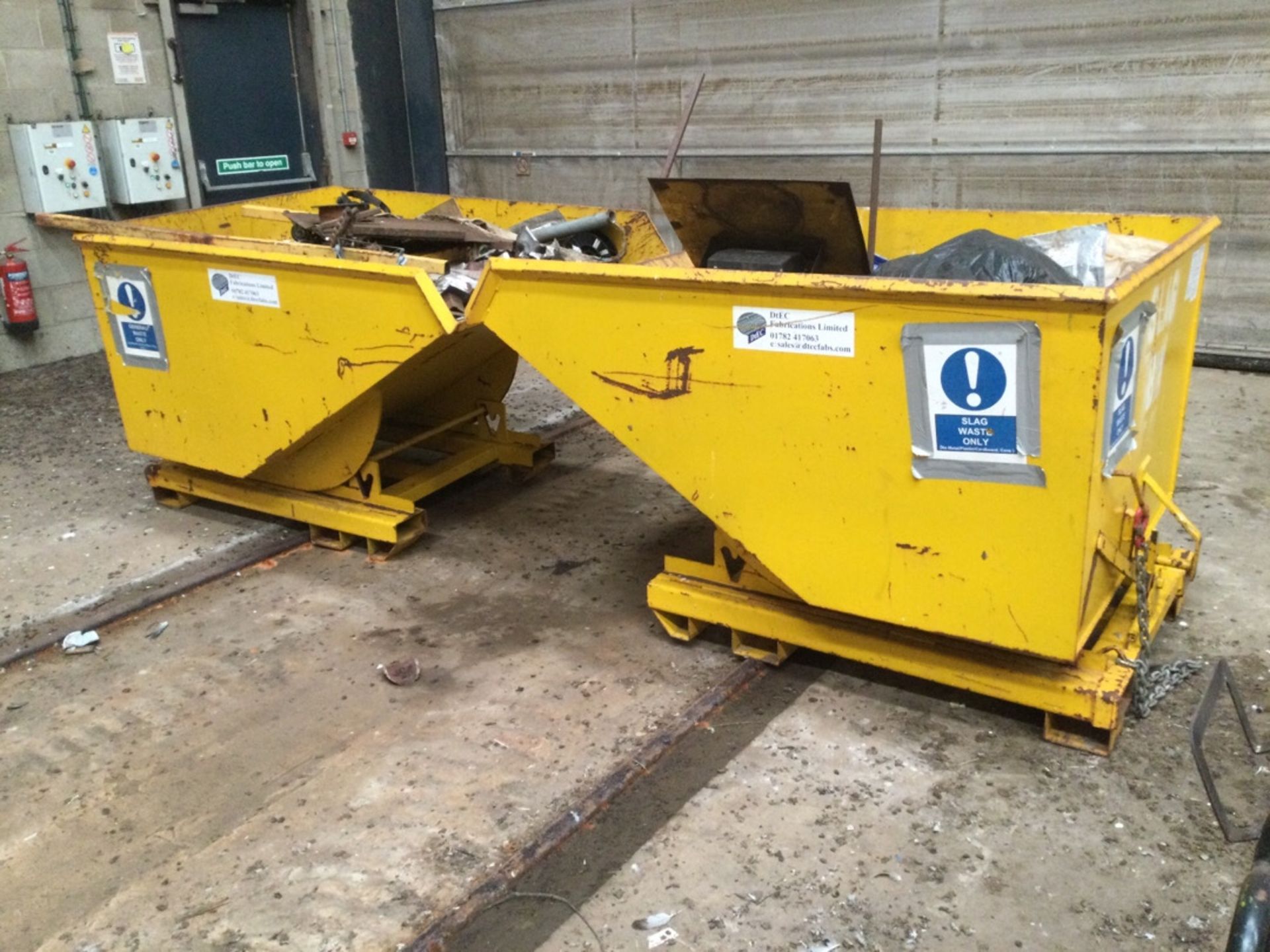 2: Yellow Forklift Tipping Skips with contents