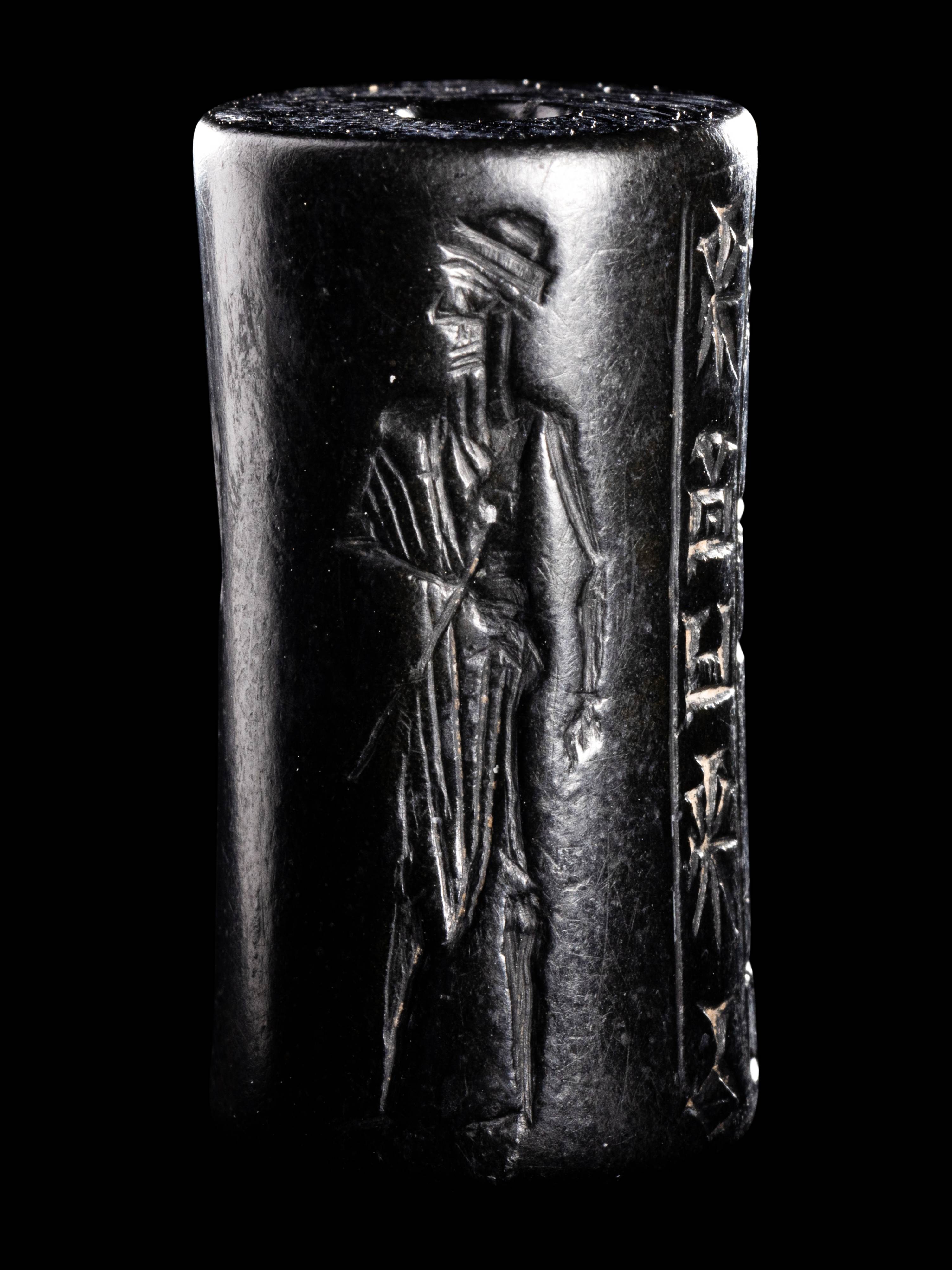 A Mesopotamian Hematite Cylinder Seal Height 1 1/16 inches (2.7 cm). - Image 2 of 4