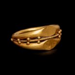 A Roman Gold Double Finger Ring Ring size 3 3/4; Diameter 5/8 inch (1.5 cm).