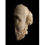 A Roman Marble Fragmentary Portrait Head of a Man Height 9 inches (23 cm).